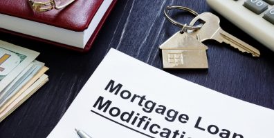 Mortgage Loan Modification agreement and keys from home.